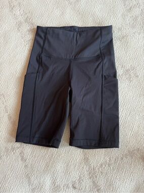 Athleta Black High-Rise Bike Shorts with Side Pockets